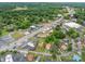 Aerial view of homes in a quiet neighborhood with tree-lined streets and nearby businesses at 3 Circle Dr, Lincolnton, NC 28092