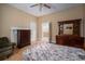 Bedroom with hardwood floors and classic wooden furnishings, bathed in natural light at 3 Circle Dr, Lincolnton, NC 28092