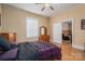 Modest bedroom with a bed, dresser, and a view into another room and window view at 3 Circle Dr, Lincolnton, NC 28092
