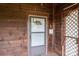 Close-up view of the front door, featuring a screen door and decorative house number detail at 3 Circle Dr, Lincolnton, NC 28092