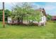 Modest home featuring a covered back porch, leafy tree, and a well-maintained lawn at 3 Circle Dr, Lincolnton, NC 28092