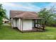Charming single-story home featuring a covered porch and mature trees in a well-maintained lawn at 3 Circle Dr, Lincolnton, NC 28092