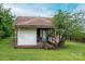 Exterior view of home featuring a covered back porch and small front yard with mature landscaping at 3 Circle Dr, Lincolnton, NC 28092