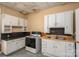 Practical kitchen with white appliances, ample cabinet space, and linoleum flooring and an electric range at 3 Circle Dr, Lincolnton, NC 28092