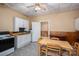 Efficient kitchen with essential appliances, a dining table, and linoleum flooring with adjacent doorway at 3 Circle Dr, Lincolnton, NC 28092