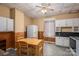 Functional kitchen featuring linoleum flooring, a dining area, a white refrigerator, and natural light at 3 Circle Dr, Lincolnton, NC 28092