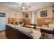 Cozy living room with wood paneling, ceiling fan, neutral-colored furniture and a door leading outside at 3 Circle Dr, Lincolnton, NC 28092