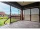 Spacious screened-in porch with brick pillars, offering an outdoor living space and backyard views at 3 Circle Dr, Lincolnton, NC 28092
