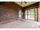 Covered porch with wood accents offering a shaded retreat, complete with ceiling fan at 3 Circle Dr, Lincolnton, NC 28092