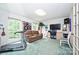 Spacious bonus room with a sofa, treadmill and large windows offering natural light at 3017 Brooks Mill Ln # 10, Wingate, NC 28174