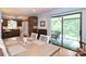 Dining room with table for four, light blue walls and access to a screened porch at 3017 Brooks Mill Ln # 10, Wingate, NC 28174