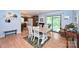 Cozy dining room features hardwood floors, light blue walls and access to the screened porch at 3017 Brooks Mill Ln # 10, Wingate, NC 28174