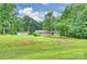 Charming ranch-style home nestled among mature trees with detached garage on a spacious lot at 3017 Brooks Mill Ln # 10, Wingate, NC 28174