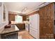 Well-lit kitchen featuring wooden cabinets, granite countertops, and modern appliances at 3017 Brooks Mill Ln # 10, Wingate, NC 28174