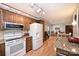 Bright kitchen showcasing wooden cabinets, modern appliances and adjacent dining area at 3017 Brooks Mill Ln # 10, Wingate, NC 28174