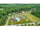 Beautiful aerial view of community amenities including a pool, tennis court, playground, and clubhouse at 319 S San Agustin Dr, Mooresville, NC 28117