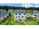 Aerial view of backyard with deck, lawn, landscaping, and a fenced perimeter at 319 S San Agustin Dr, Mooresville, NC 28117