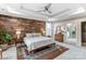 Tranquil bedroom with wood accent wall, ceiling fan, and natural light at 319 S San Agustin Dr, Mooresville, NC 28117