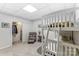 Bedroom with white bunk beds, carpeted floor, and closet with washer and dryer in view at 319 S San Agustin Dr, Mooresville, NC 28117