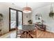 Cozy breakfast nook featuring a round table, hardwood floors, and a view of the outdoor deck at 319 S San Agustin Dr, Mooresville, NC 28117