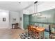 Inviting dining area with wooden table, bench seating, and stylish decor at 319 S San Agustin Dr, Mooresville, NC 28117
