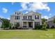 Charming two-story home with a covered porch, dormer windows, and a well-manicured lawn at 319 S San Agustin Dr, Mooresville, NC 28117