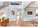Welcoming foyer with hardwood floors, staircase, and views into the dining and living areas at 319 S San Agustin Dr, Mooresville, NC 28117