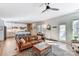 Inviting living room with hardwood floors, a cozy couch, and plenty of natural light at 319 S San Agustin Dr, Mooresville, NC 28117