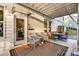 Covered patio with a seating area, outdoor furniture, and view of the landscaped yard at 319 S San Agustin Dr, Mooresville, NC 28117