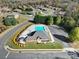 Aerial view showcasing community pool, clubhouse, landscaping, and surrounding neighborhood at 3342 Yarmouth Ln, Gastonia, NC 28056