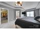 Comfortable bedroom with neutral colors, a walk-in closet, and a view to the ensuite bath at 3342 Yarmouth Ln, Gastonia, NC 28056