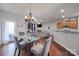 Bright dining area with a modern chandelier, open to the living room and kitchen, perfect for entertaining at 3342 Yarmouth Ln, Gastonia, NC 28056
