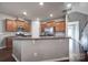 Open kitchen featuring granite countertops, stainless steel appliances, and rich hardwood flooring at 3342 Yarmouth Ln, Gastonia, NC 28056
