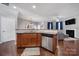 Modern kitchen seamlessly blending into the living space with stainless steel appliances and hardwood floors at 3342 Yarmouth Ln, Gastonia, NC 28056