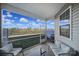 Screened-in patio with comfortable seating and a view of the backyard and blue sky at 3342 Yarmouth Ln, Gastonia, NC 28056