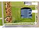 Aerial view of a well-maintained property featuring a spacious yard and a paved street at 3924 Dahlia Dr, Harrisburg, NC 28075
