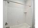 Clean bathroom with white tile and shower head at 3924 Dahlia Dr, Harrisburg, NC 28075