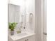 Bathroom with a white sink, granite countertop, and gray accent plant at 3924 Dahlia Dr, Harrisburg, NC 28075