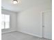 A bright bedroom with a window and door at 3924 Dahlia Dr, Harrisburg, NC 28075