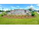 The community's entrance showcases beautifully designed stone signage and landscaping at 3924 Dahlia Dr, Harrisburg, NC 28075