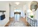 Bright entryway with hardwood floors leads to a spacious living area with modern decor at 3924 Dahlia Dr, Harrisburg, NC 28075