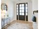 Bright foyer with hardwood floors, stylish rug, and decorative accents at 3924 Dahlia Dr, Harrisburg, NC 28075
