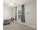 Bedroom featuring neutral walls, neutral carpet, one window and a doll house at 4278 Park South Station Blvd, Charlotte, NC 28210