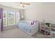 Bright bedroom featuring large window, neutral carpet, ceiling fan, and daybed at 4278 Park South Station Blvd, Charlotte, NC 28210