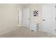 This bedroom features neutral walls, white trim, and carpet flooring, offering a cozy and inviting space at 4278 Park South Station Blvd, Charlotte, NC 28210