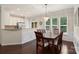 Dining area features hardwood floors, wainscoting, chandelier, and an opening to the kitchen at 4278 Park South Station Blvd, Charlotte, NC 28210