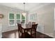 Bright dining room features a decorative chandelier and several windows for natural light at 4278 Park South Station Blvd, Charlotte, NC 28210