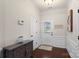 Foyer with hardwood floors, white trim, and neutral paint providing a welcoming entry at 4278 Park South Station Blvd, Charlotte, NC 28210