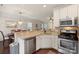 Kitchen with granite counters and stainless appliances adjacent to dining area at 4278 Park South Station Blvd, Charlotte, NC 28210