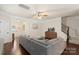 Cozy living room with a sectional sofa, hardwood floors, and staircase access at 4278 Park South Station Blvd, Charlotte, NC 28210